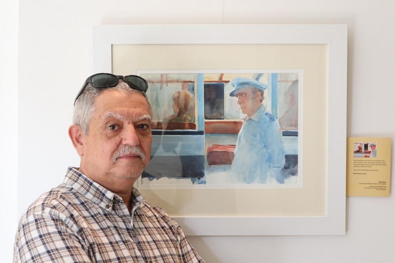 Paul Caruana painting in his studio in Malta